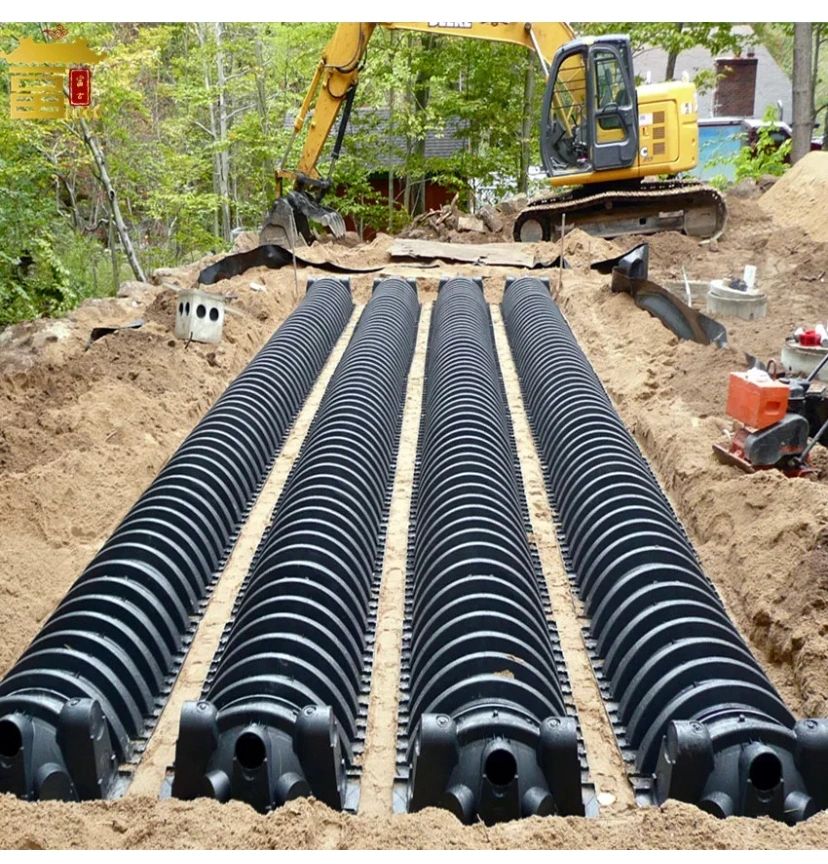 Installation and excavation of a septic system with 4 large pipes underground.